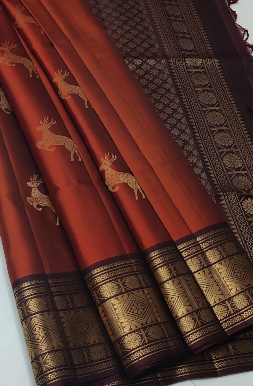 Kanchipuram Silk Saree featuring extensive gold zari Maroon